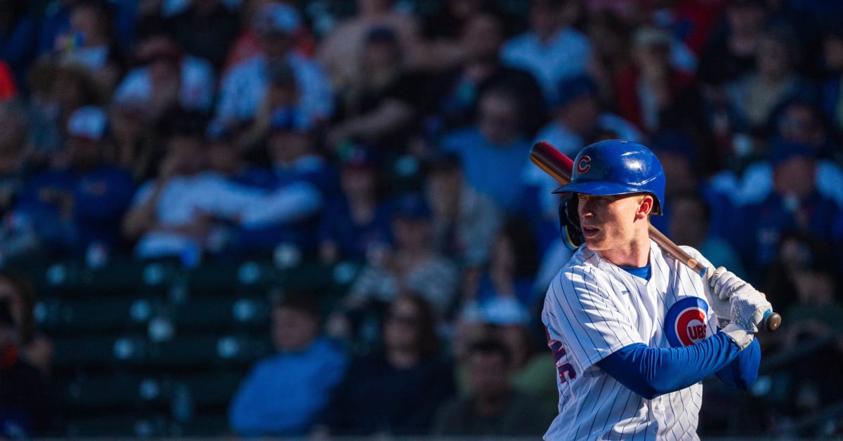 A Chicago Cubs spring training cap sits on the bench during the