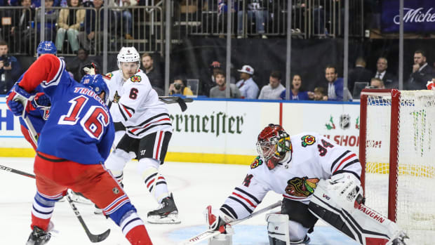 Dec 3, 2022; New York, New York, USA; Chicago Blackhawks goaltender Petr Mrazek (34) prepares to defend against a shot goal attempt by New York Rangers center Vincent Trocheck (16) in the second period at Madison Square Garden.