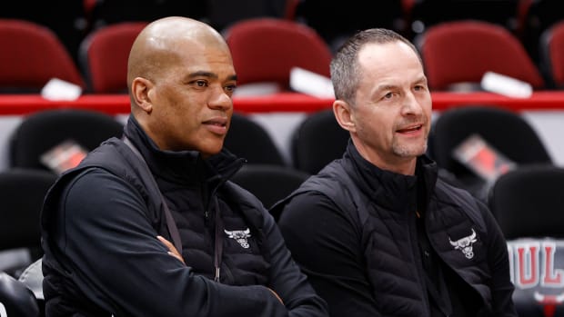 Apr 22, 2022; Chicago, Illinois, USA; Chicago Bulls executive vice president of basketball operations Arturas Karnisovas (right) talks with general manager Marc Eversley (left) before game three of the first round for the 2022 NBA playoffs against the Milwaukee Bucks at United Center.
