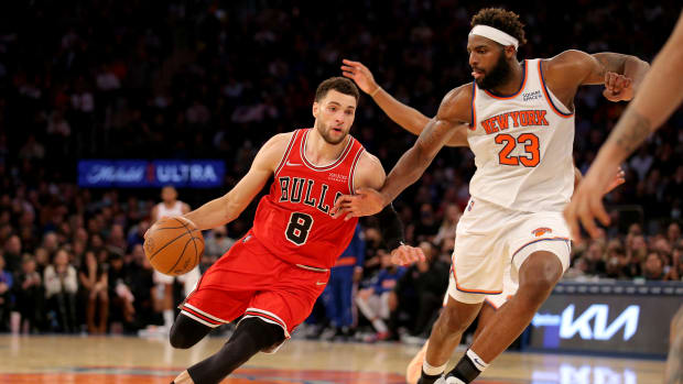 Dec 2, 2021; New York, New York, USA; Chicago Bulls guard Zach LaVine (8) drives to the basket against New York Knicks center Mitchell Robinson (23) during the fourth quarter at Madison Square Garden.
