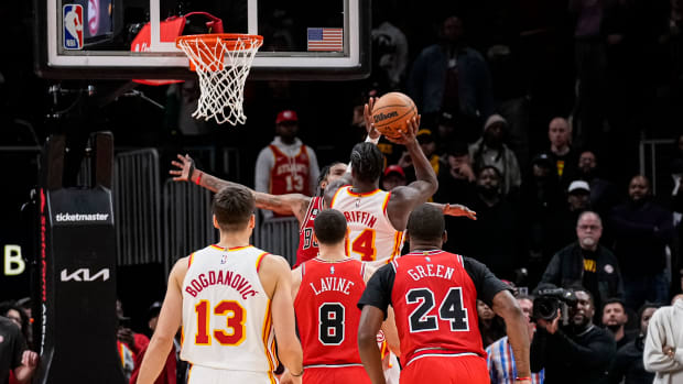 Dec 11, 2022; Atlanta, Georgia, USA; Atlanta Hawks forward AJ Griffin (14) catches an inbounds pass and makes a shot at the buzzer to defeat the Chicago Bulls in overtime at State Farm Arena.