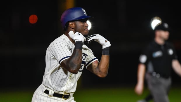 Aug 12, 2021; Dyersville, Iowa, USA; Chicago White Sox shortstop Tim Anderson (7) reacts after hitting a two-run home run in the ninth inning to defeat the New York Yankees at Field of Dreams.