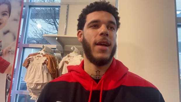 Chicago Bulls point guard Lonzo Ball speaks to reporters about his injury status at a gift drive for Fathers Families & Healthy Communities on Wednesday, Dec. 21, 2022