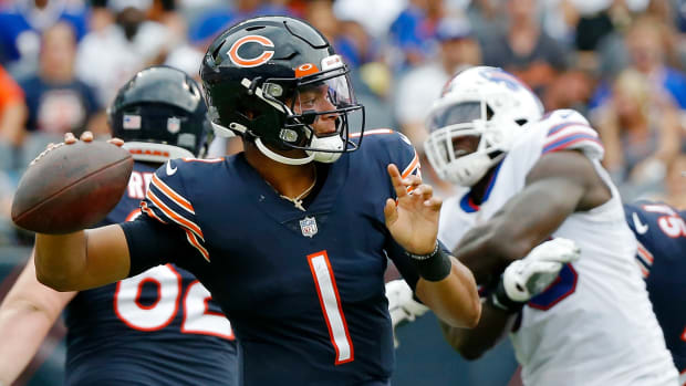 Aug 21, 2021; Chicago, Illinois, USA; Chicago Bears quarterback Justin Fields (1) looks to pass the ball against the Buffalo Bills during the second half at Soldier Field.