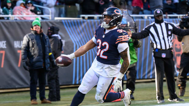 Dec 18, 2022; Chicago, Illinois, USA; Chicago Bears running back David Montgomery (32) runs for a touchdown after a reception in the third quarter against the Philadelphia Eagles at Soldier Field.