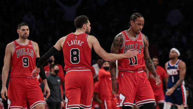 Dec 4, 2021; Brooklyn, New York, USA; Chicago Bulls guard Zach LaVine (8) boats Chicago Bulls forward DeMar DeRozan (11) on the chest after a three point basket against the Brooklyn Nets during the second half at Barclays Center.
