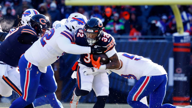 Dec 24, 2022; Chicago, Illinois, USA; Chicago Bears running back David Montgomery (32) rushes the ball against the Buffalo Bills during the first quarter at Soldier Field.