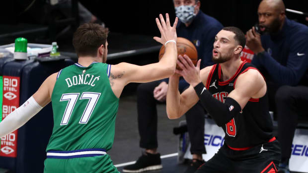 Jan 17, 2021; Dallas, Texas, USA; Chicago Bulls guard Zach LaVine (8) looks to shoot as Dallas Mavericks guard Luka Doncic (77) defends during the first half at American Airlines Center.