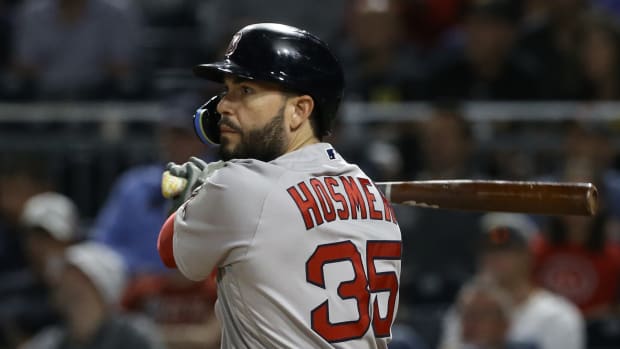 Aug 17, 2022; Pittsburgh, Pennsylvania, USA; Boston Red Sox first baseman Eric Hosmer (35) hits a single against the Pittsburgh Pirates during the eighth inning at PNC Park.