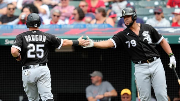 Sep 26, 2021; Cleveland, Ohio, USA; Chicago White Sox Andrew Vaughn (25) slaps hands with Jose Abreu (79) after scoring in the sixth inning against the Cleveland Indians at Progressive Field.