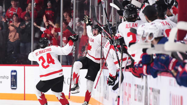 Chicago Blackhawks prospect Ethan Del Mastro celebrates with a goal with teammates during Canada's semifinal victory over Team USA at the 2023 World Juniors