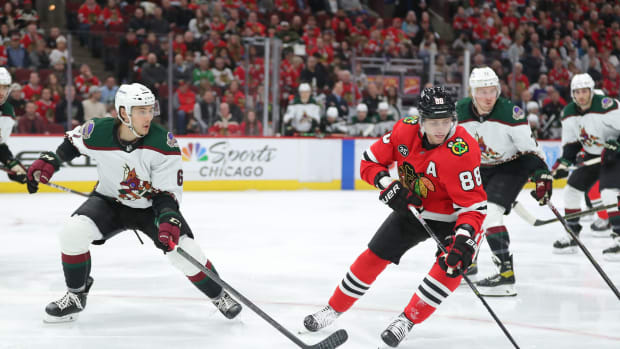 Apr 3, 2022; Chicago, Illinois, USA; Chicago Blackhawks right wing Patrick Kane (88) skates past Arizona Coyotes defenseman Jakob Chychrun (6) during the first period at the United Center.