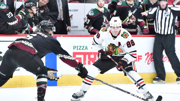Dec 12, 2019; Glendale, AZ, USA; Chicago Blackhawks right wing Patrick Kane (88) carries the puck as Arizona Coyotes defenseman Jakob Chychrun (6) defends during the third period at Gila River Arena.