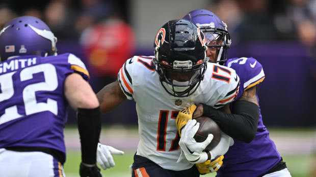 Oct 9, 2022; Minneapolis, Minnesota, USA; Minnesota Vikings cornerback Cameron Dantzler Sr. (3) strips the ball from Chicago Bears wide receiver Ihmir Smith-Marsette (17) during the fourth quarter as safety Harrison Smith (22) gets ready for the tackle at U.S. Bank Stadium.