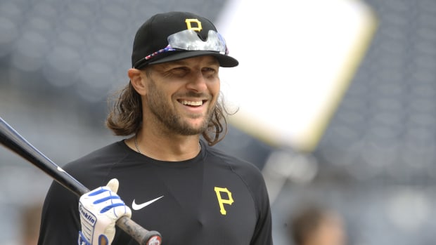Apr 12, 2022; Pittsburgh, Pennsylvania, USA; Pittsburgh Pirates left fielder Jake Marisnick (41) smiles at the batting cage before the game against the Chicago Cubs at PNC Park.