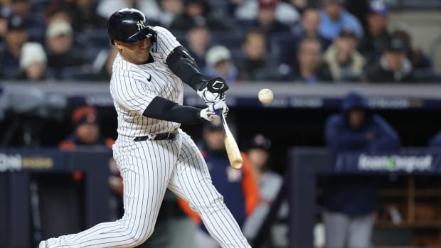 Oct 23, 2022; Bronx, New York, USA; New York Yankees second baseman Gleyber Torres (25) hits a hits an RBI in the first inning against the Houston Astros during game four of the ALCS for the 2022 MLB Playoffs at Yankee Stadium.