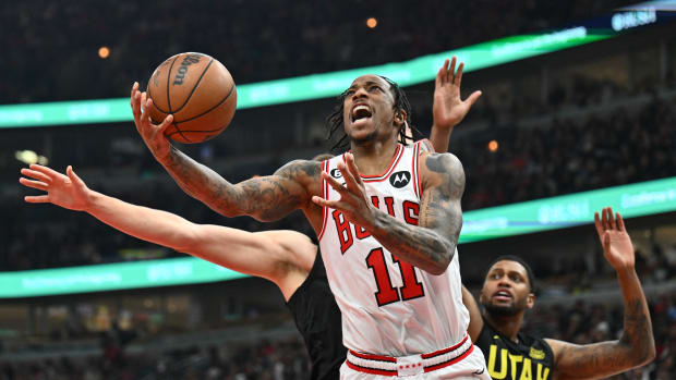 Jan 7, 2023; Chicago, Illinois, USA; Chicago Bulls guard DeMar DeRozan (11) attempts a shot under the basket against the Utah Jazz in the second half at United Center. Chicago defeated Utah 126-118.