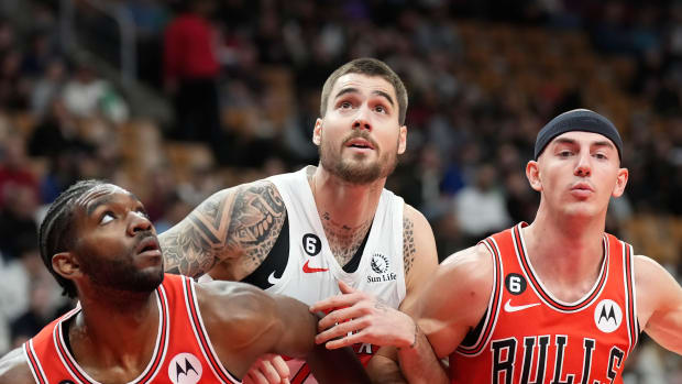 Toronto Raptors forward Juancho Hernangomez (41) is boxed out by Chicago Bulls forward Patrick Williams (44) and guard Alex Caruso (6) during the first half at Scotiabank Arena.