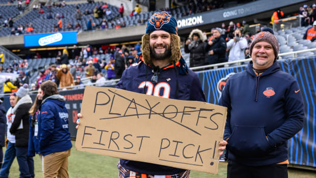 Jan 8, 2023; Chicago, Illinois, USA; A Chicago Bears fan holds a sign before the game against the Minnesota Vikings at Soldier Field.