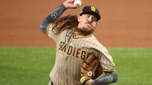 Oct 6, 2020; Arlington, Texas, USA; San Diego Padres starting pitcher Mike Clevinger (52) pitches against the Los Angeles Dodgers during the first inning in game one of the 2020 NLDS at Globe Life Field.
