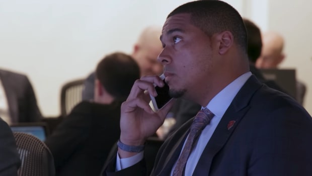 Chicago Bears general manager Ryan Poles takes a phone call on NFL Draft Day
