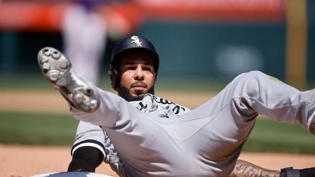 Jul 27, 2022; Denver, Colorado, USA; Chicago White Sox center fielder Leury Garcia (28) reacts after getting picked off at third base in the fifth inning against the Colorado Rockies at Coors Field.
