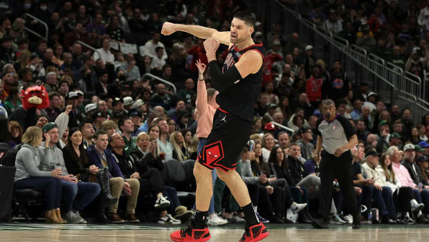 Chicago Bulls center Nikola Vucevic celebrates a big moment in a 2022 playoff game against the Milwaukee Bucks