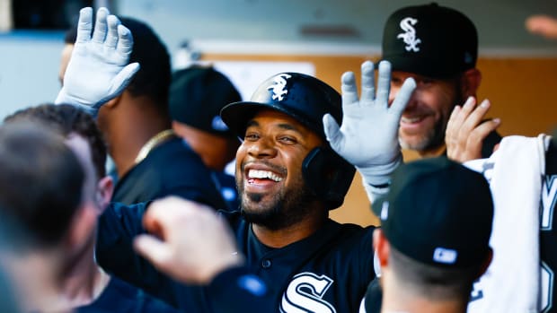 Sep 5, 2022; Seattle, Washington, USA; Chicago White Sox shortstop Elvis Andrus (1) high-fives teammates in the dugout after hitting a two-run home run against the Seattle Mariners during the third inning at T-Mobile Park.