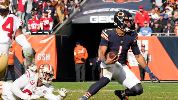 Oct 31, 2021; Chicago, Illinois, USA; Chicago Bears quarterback Justin Fields (1) rushes the ball against the San Francisco 49ers during the second half at Soldier Field.
