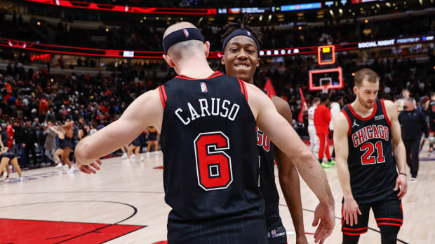 Jan 19, 2022; Chicago, Illinois, USA; Chicago Bulls guard Alex Caruso (6) and guard Ayo Dosunmu (12) celebrate after team's win against the Cleveland Cavaliers at United Center.