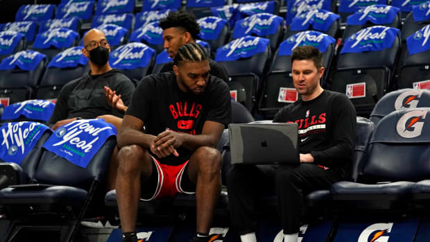 Apr 10, 2022; Minneapolis, Minnesota, USA; Chicago Bulls forward Patrick Williams (44) reviews film with assistant coach Josh Longstaff during shoot around before a game against the Minnesota Timberwolves at Target Center.