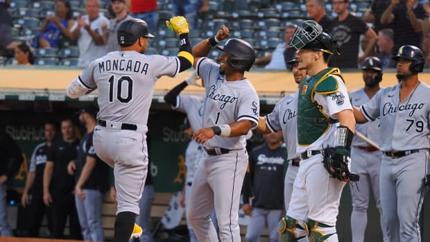 Sep 8, 2022; Oakland, California, USA; Chicago White Sox third baseman Yoan Moncada (10) celebrates with shortstop Elvis Andrus (1) ahead of catcher Sean Murphy (12) after batting in Andrus and catcher Seby Zavala (44) on a three-run home run against the Oakland Athletics during the second inning at RingCentral Coliseum.