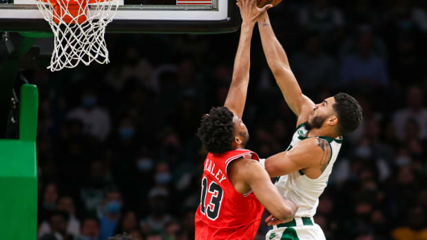 Nov 1, 2021; Boston, Massachusetts, USA; Chicago Bulls center Tony Bradley (13) blocks Boston Celtics forward Jayson Tatum (0) during the second half at TD Garden.