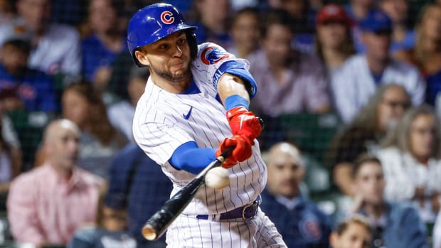 Sep 6, 2022; Chicago, Illinois, USA; Chicago Cubs second baseman Nick Madrigal (1) hits a two-run single against the Cincinnati Reds during the sixth inning at Wrigley Field.