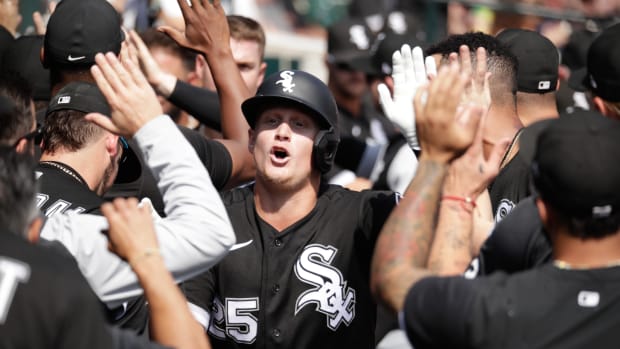 Sep 18, 2022; Detroit, Michigan, USA; Chicago White Sox first baseman Andrew Vaughn (25) high-fives teammates after hitting a grand slam in the fifth inning of the game against the Detroit Tigers at Comerica Park.