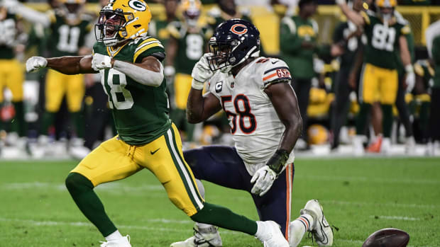 Sep 18, 2022; Green Bay, Wisconsin, USA; Green Bay Packers wide receiver Randall Cobb (18) reacts after catching a pass against Chicago Bears linebacker Roquan Smith (58) for a first down in the second quarter at Lambeau Field.