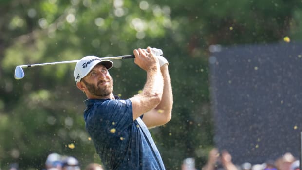 Sep 4, 2022; Boston, Massachusetts, USA; Dustin Johnson captain of team Aces tees off on the 17th during the final round of the LIV Golf tournament at The International.
