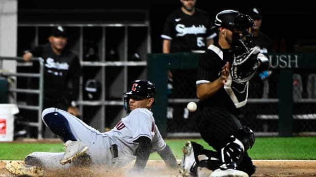 Sep 20, 2022; Chicago, Illinois, USA; Cleveland Guardians second baseman Andres Gimenez (0) scores past Chicago White Sox catcher Seby Zavala (44) during the second inning at Guaranteed Rate Field.