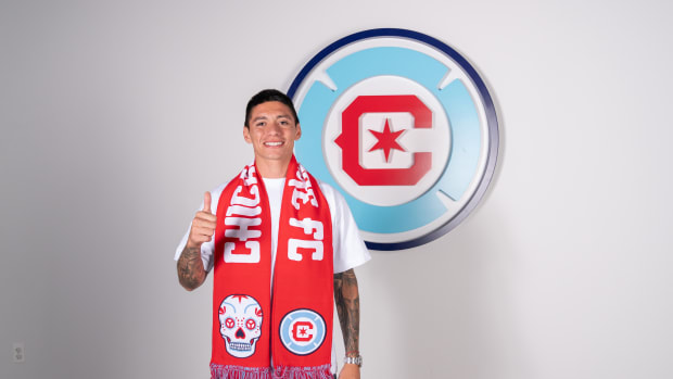 Federico Navarro poses with a thumbs-up gesture after signing a contract extension with Chicago Fire FC