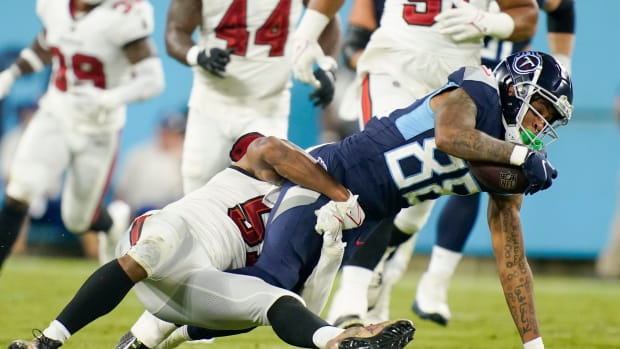 Tennessee Titans wide receiver Reggie Roberson Jr. (88) is tackled by Tampa Bay Buccaneers linebacker J.J. Russell (51) during the third quarter of a preseason game at Nissan Stadium Saturday, Aug. 20, 2022, in Nashville, Tenn.