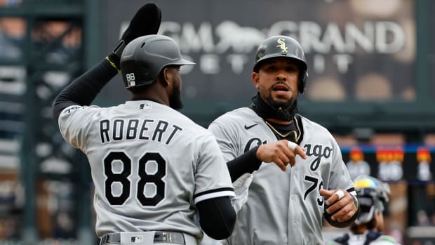 Apr 9, 2022; Detroit, Michigan, USA; Chicago White Sox center fielder Luis Robert (88) and first baseman Jose Abreu (79) congratulate each other after scoring in the first inning against the Detroit Tigers at Comerica Park.