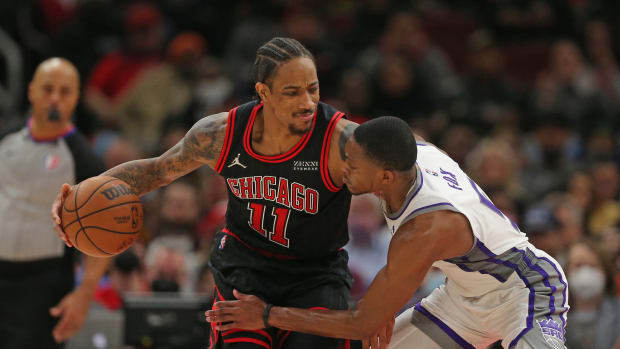 Feb 16, 2022; Chicago, Illinois, USA; Chicago Bulls forward DeMar DeRozan (11) is defended by Sacramento Kings guard De'Aaron Fox (5) during the second half at the United Center.