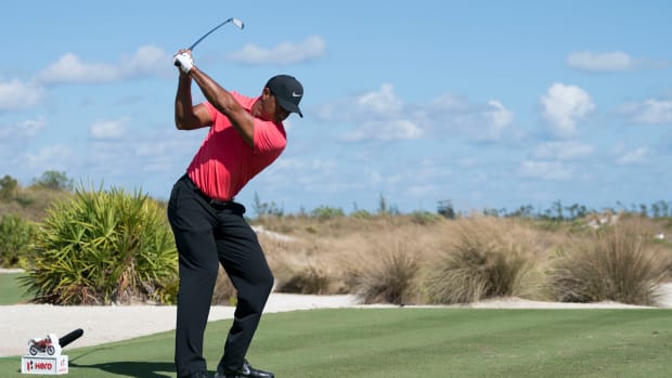 December 3, 2017; New Providence, The Bahamas; Tiger Woods hits his tee shot on the eighth hole during the final round of the Hero World Challenge golf tournament at Albany.
