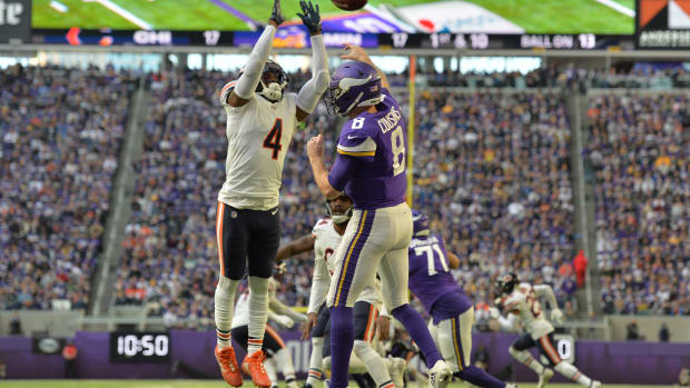 Jan 9, 2022; Minneapolis, Minnesota, USA; Chicago Bears free safety Eddie Jackson (4) defends the pass of Minnesota Vikings quarterback Kirk Cousins (8) during the fourth quarter at U.S. Bank Stadium.