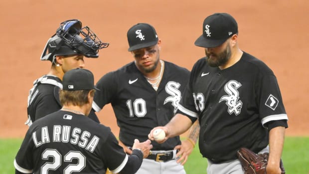 Jul 11, 2022; Cleveland, Ohio, USA; Chicago White Sox manager Tony La Russa (22) takes the ball from starting pitcher Lance Lynn (33) during a pitching change in the fifth inning against the Cleveland Guardians at Progressive Field.