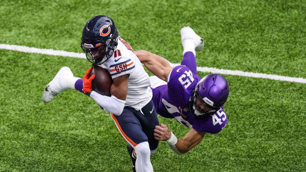 Dec 20, 2020; Minneapolis, Minnesota, USA; Chicago Bears wide receiver Darnell Mooney (11) runs with the ball for a touchdown past Minnesota Vikings linebacker Troy Dye (45) during the first quarter at U.S. Bank Stadium.