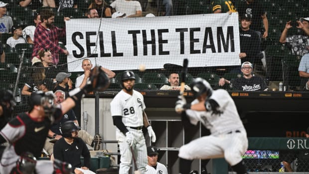 Aug 27, 2022; Chicago, Illinois, USA; Frustrated Chicago White Sox fans hold up a sign urging to sell the team as outfielder AJ Pollock (18) bats in the ninth inning against the Arizona Diamondbacks at Guaranteed Rate Field. Arizona defeated Chicago 10-5.
