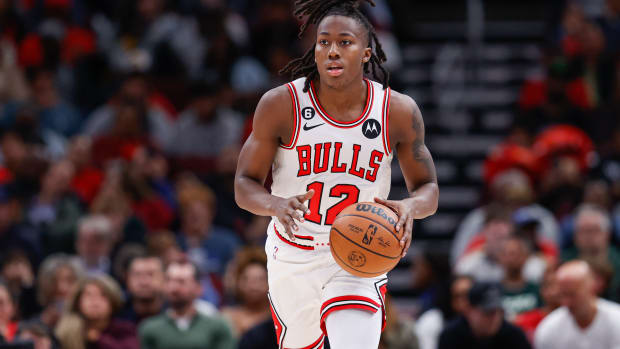 Oct 11, 2022; Chicago, Illinois, USA; Chicago Bulls guard Ayo Dosunmu (12) brings the ball up court against the Milwaukee Bucks during the first half of a preseason NBA basketball game at United Center.
