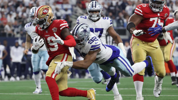 Jan 16, 2022; Arlington, Texas, USA; Dallas Cowboys defensive end Dorance Armstrong (92) attempts to tackle San Francisco 49ers wide receiver Deebo Samuel (19) during the first half of the NFC Wild Card playoff football game at AT&T Stadium.