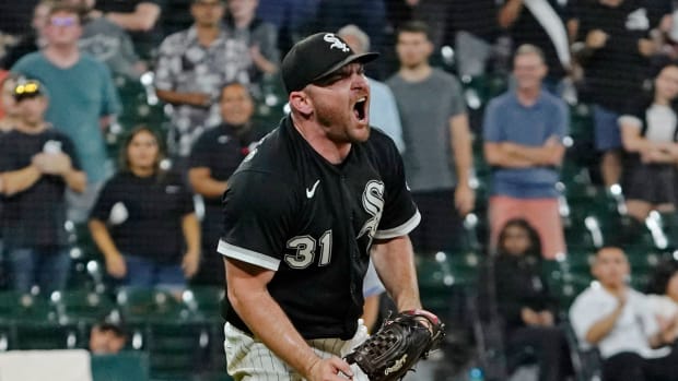 Aug 31, 2022; Chicago, Illinois, USA; Chicago White Sox relief pitcher Liam Hendriks (31) reacts after getting the final out against the Kansas City Royals at Guaranteed Rate Field.